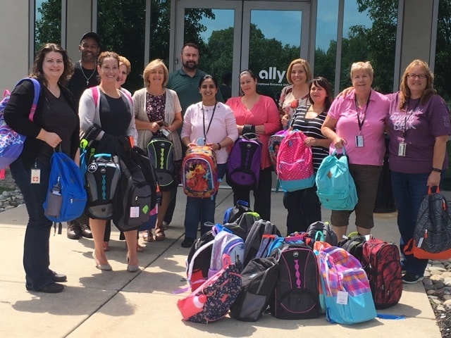 Ally Bank volunteers with back bags